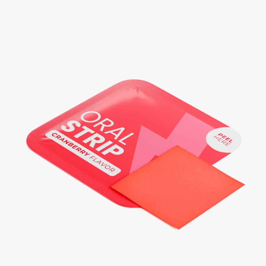 Cranberry oral strip sliding out of its sachet